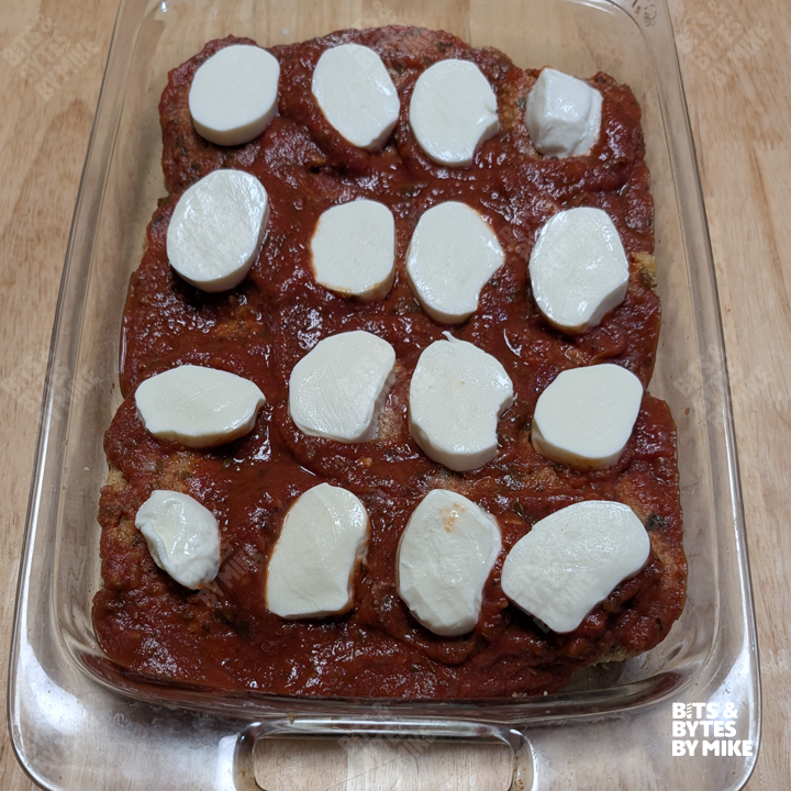 Photo of chicken topped with mozzarella cheese